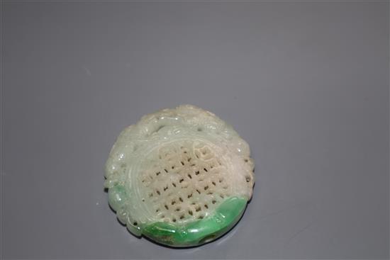 A carved jade plaque, diameter 5cm